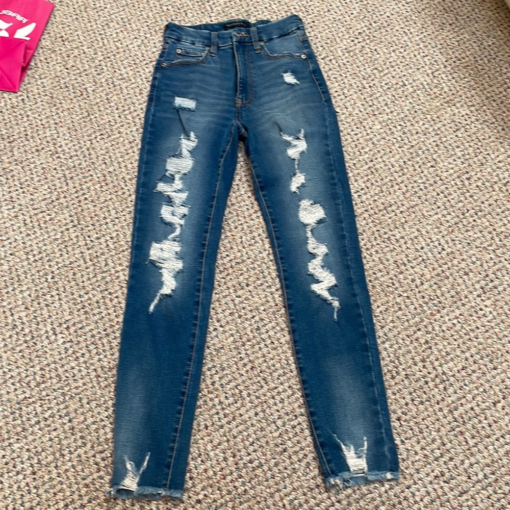 Dark blue ripped jeans